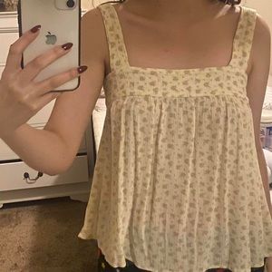 Pastel yellow flowy blouse. Size small, New with tags